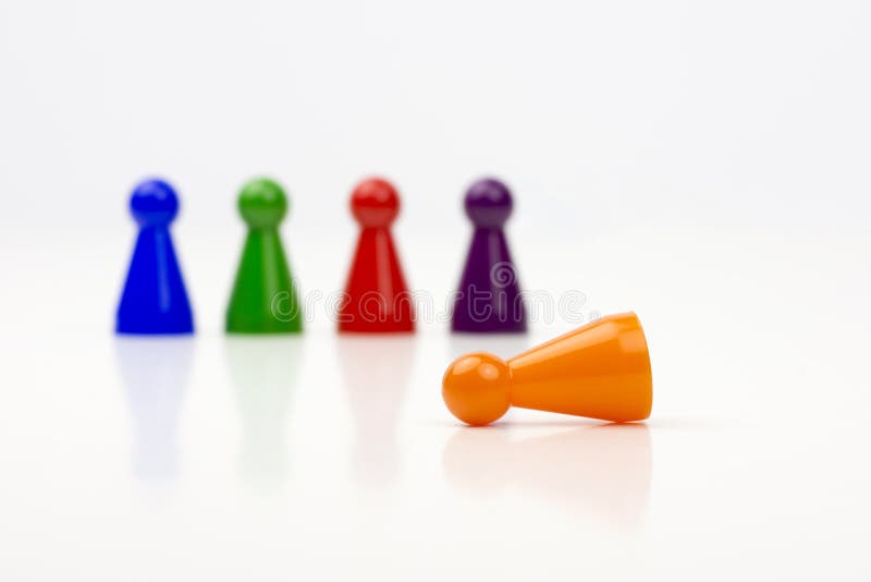 Close-up photo of a group of different-colored pieces in different positions on a white background stock photo