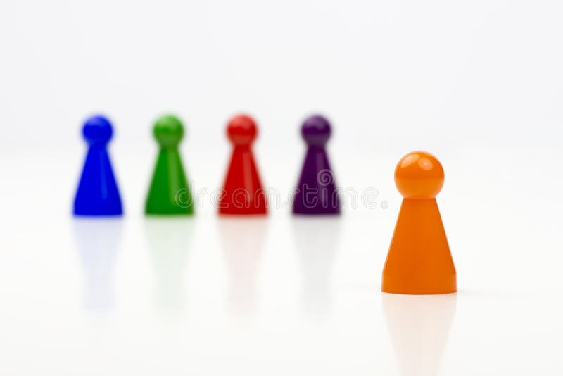 Close-up photo of a group of different-colored pieces in different positions on a white background royalty free stock image