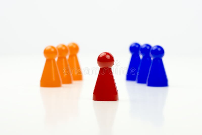 Close-up photo of a group of different-colored pieces in different positions on a white background stock image
