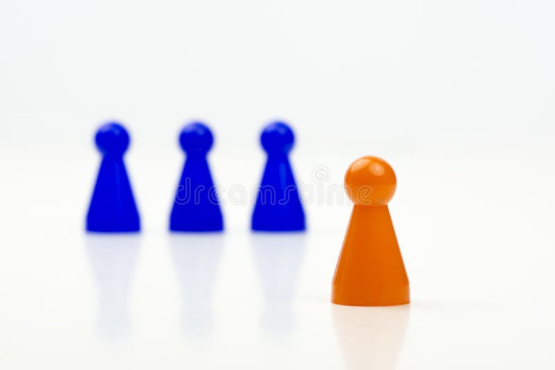 Close-up photo of a group of different-colored pieces in different positions on a white background stock images