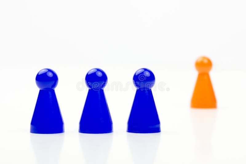 Close-up photo of a group of different-colored pieces in different positions on a white background stock images