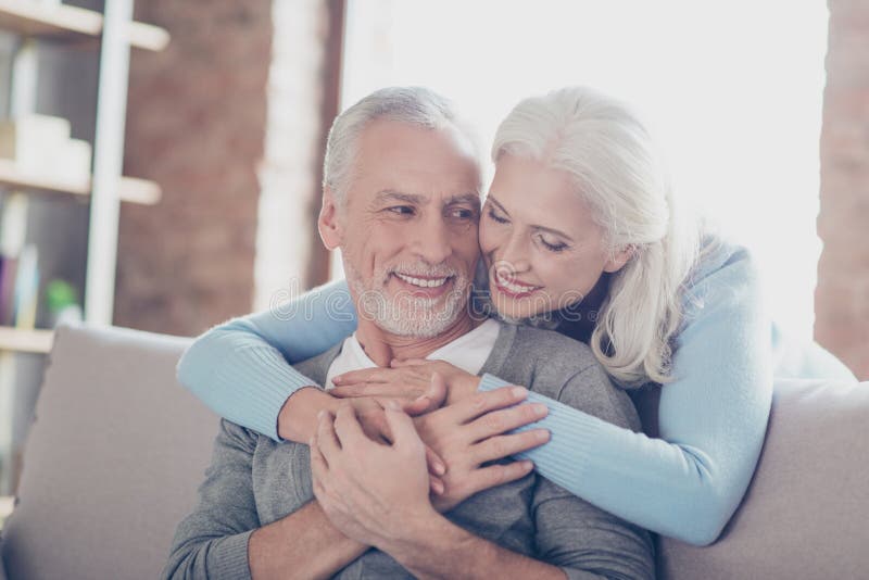 Close up photo of happy joyful beautiful couple of old people who give to each other so warm hugs stock image Close up photo of happy joyful beautiful couple of old people who give to each other so warm hugs stock image
