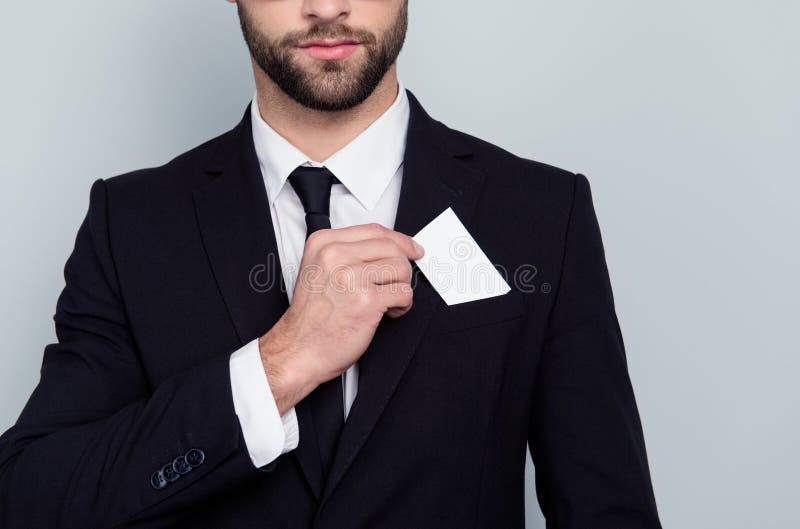 Close up photo of serious smart concentrated confident intelligent corporate executive boss chief employer employee putting card royalty free stock photography Close up photo of serious smart concentrated confident intelligent corporate executive boss chief employer employee putting card royalty free stock photography