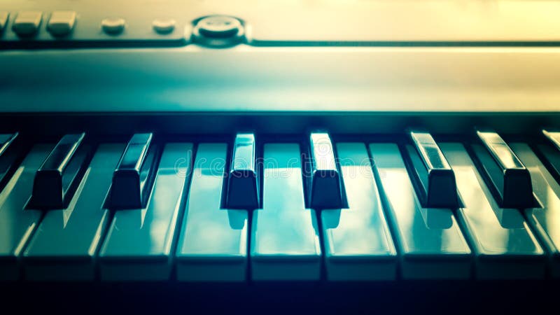 Close-up of piano keys, close up front view. Synthesizer and electronic music. Toned stock photo