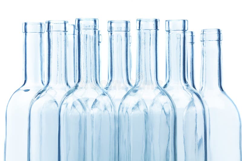 Clear glass wine bottles` necks on white