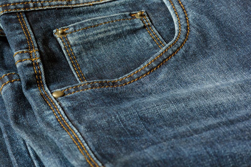 Close-up of a Piece of Blue Jeans with Orange Stitches. Stock Photo ...