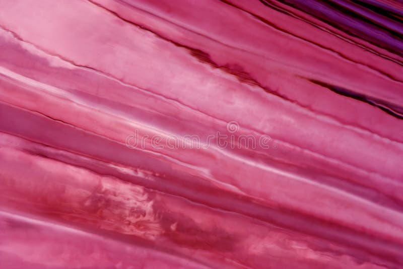 Close-up of flawed pink glass