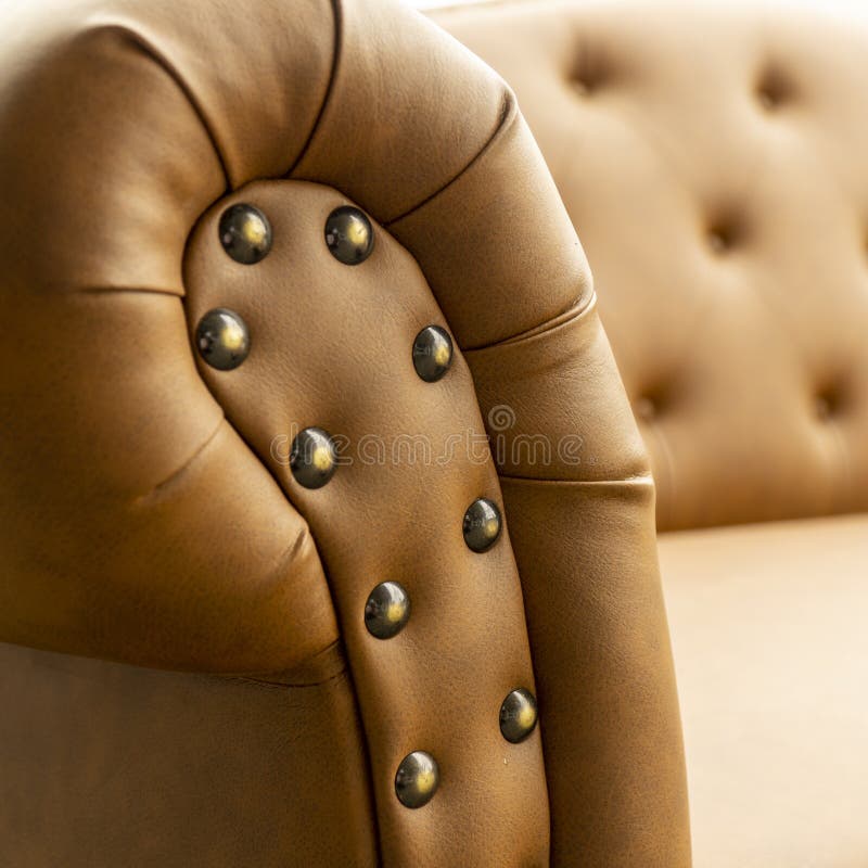 Close Up of Pins and Buttons on a Vintage Style Sofa. Buttoned
