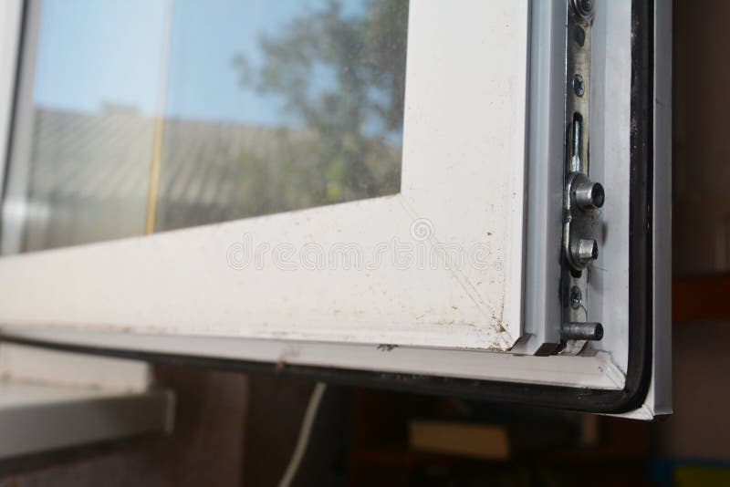 A Close-up on a Plastic Window Profile Corner with a Locking Mechanism ...