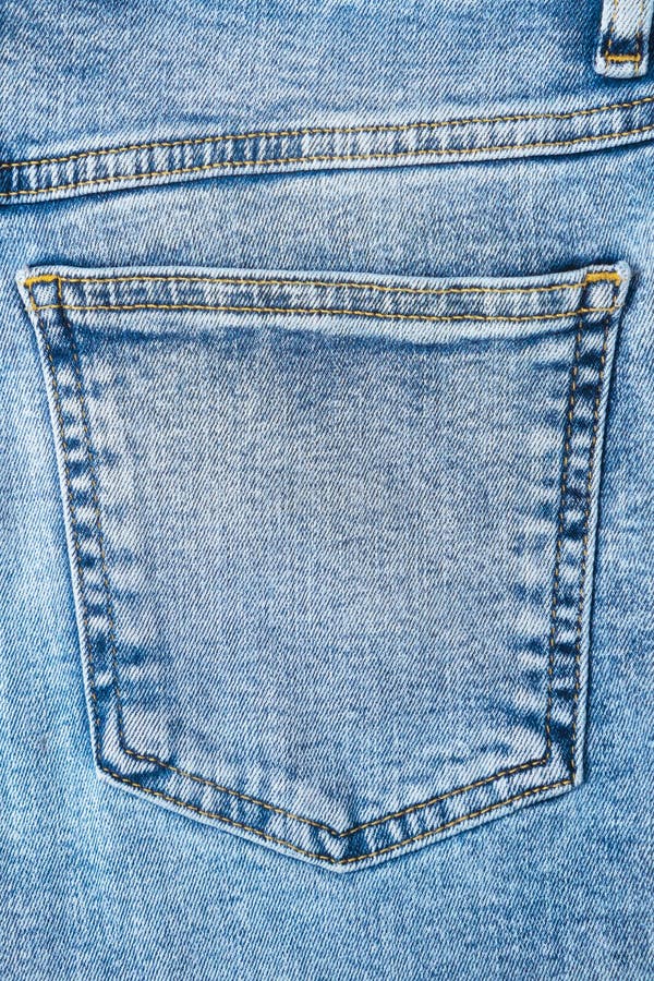 Close-up Pocket of Denim Blue Fabric with Yellow Seams. Fashionable ...