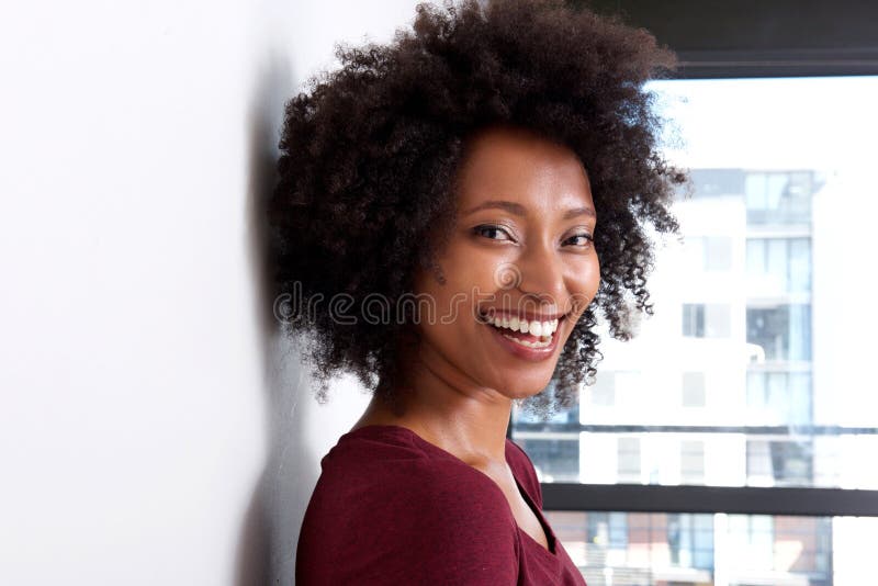Close Up African Woman with Curly Hair Leaning To Wall at Home and Smiling Stock Image - Image of fashion, background: 112576809 Close Up African Woman with Curly Hair Leaning To Wall at Home and Smiling Stock Image - Image of fashion, background: 112576809
