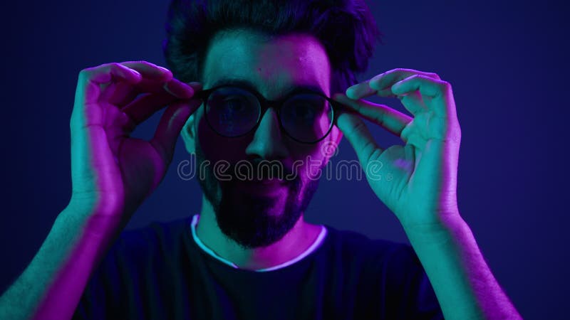 Close up portrait Arabian Indian man guy male programmer coder put on glasses 3d dimension focus gesture insight good stock video footage