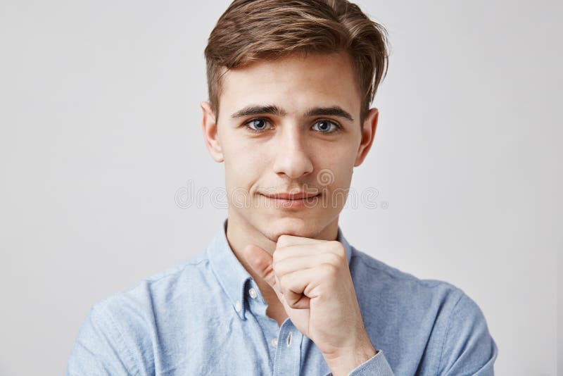 Close up portrait of attractive young guy. Please, talk, I am listening. Handsome young man hears problems of his royalty free stock photos Close up portrait of attractive young guy. Please, talk, I am listening. Handsome young man hears problems of his royalty free stock photos