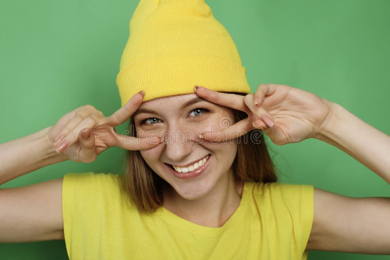 Close up portrait of beautiful joyful blonde female Face expressions, emotions, and body language. Studio shoot.