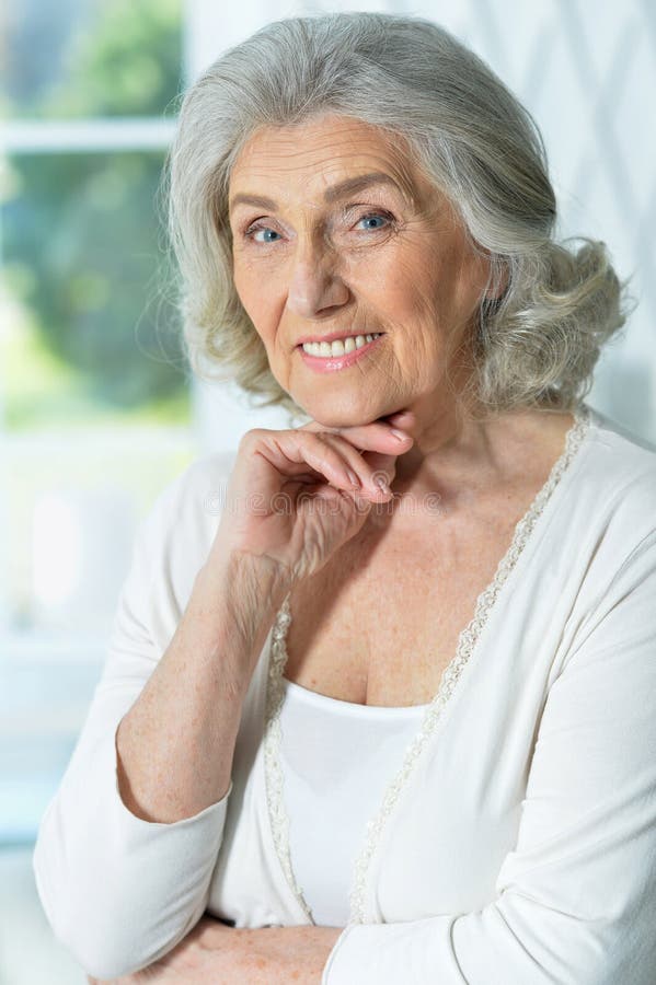Close Up Portrait Of Beautiful Smiling Senior Woman Stock Photo Image
