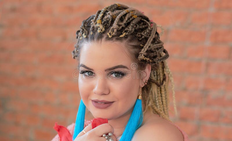 Close up portrait of a beautiful woman smiling with sweater on Brick wall background stock image Close up portrait of a beautiful woman smiling with sweater on Brick wall background stock image