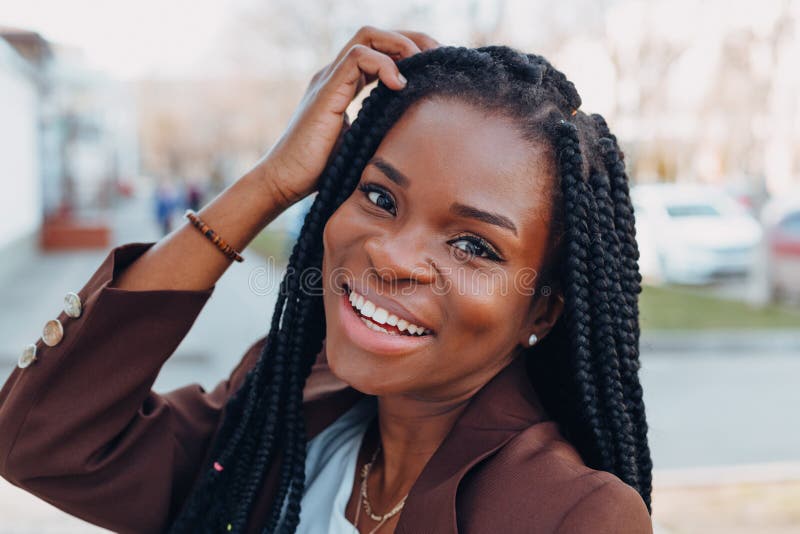 Close Up Portrait of a Beautiful Young African American Woman with Pigtails  Hairstyle in a Brown Business Suit Walks Along Spring Stock Photo - Image  of casual, model: 176243446