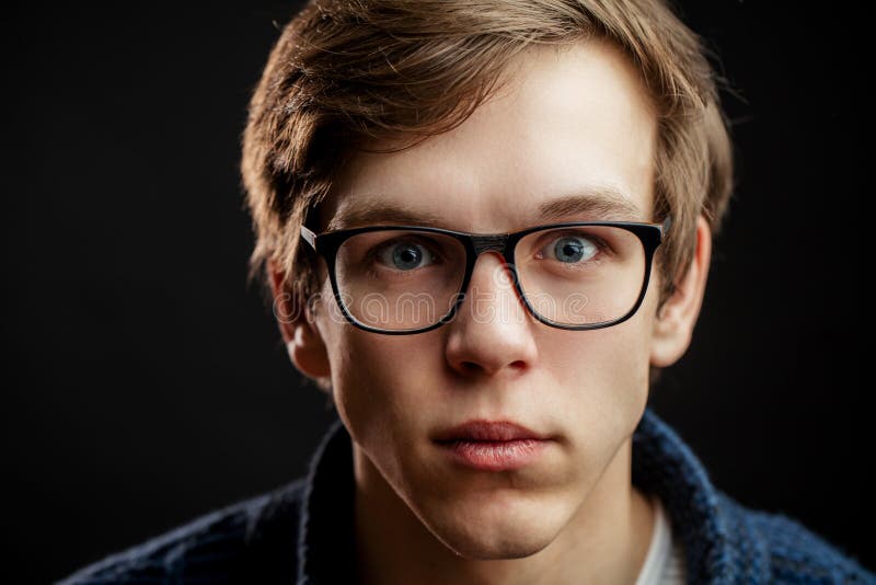 Close up portrait of blue eyes man with frightened look