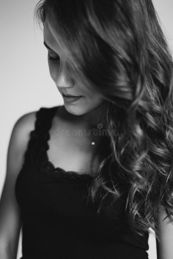 A Close Up Portrait Of A Brown Eyed Brunette Woman Of 32 Years With Beautiful Healthy Hair In A