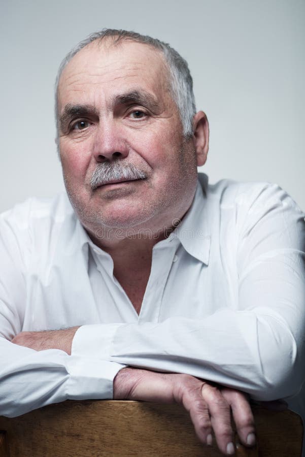 Close-up portrait of a Caucasian senior man with mustache royalty free stock photo Close-up portrait of a Caucasian senior man with mustache royalty free stock photo