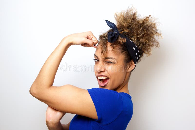 Close up portrait of cool young african american woman flexing bicep muscle. Close up portrait of cool young african american woman flexing bicep muscle