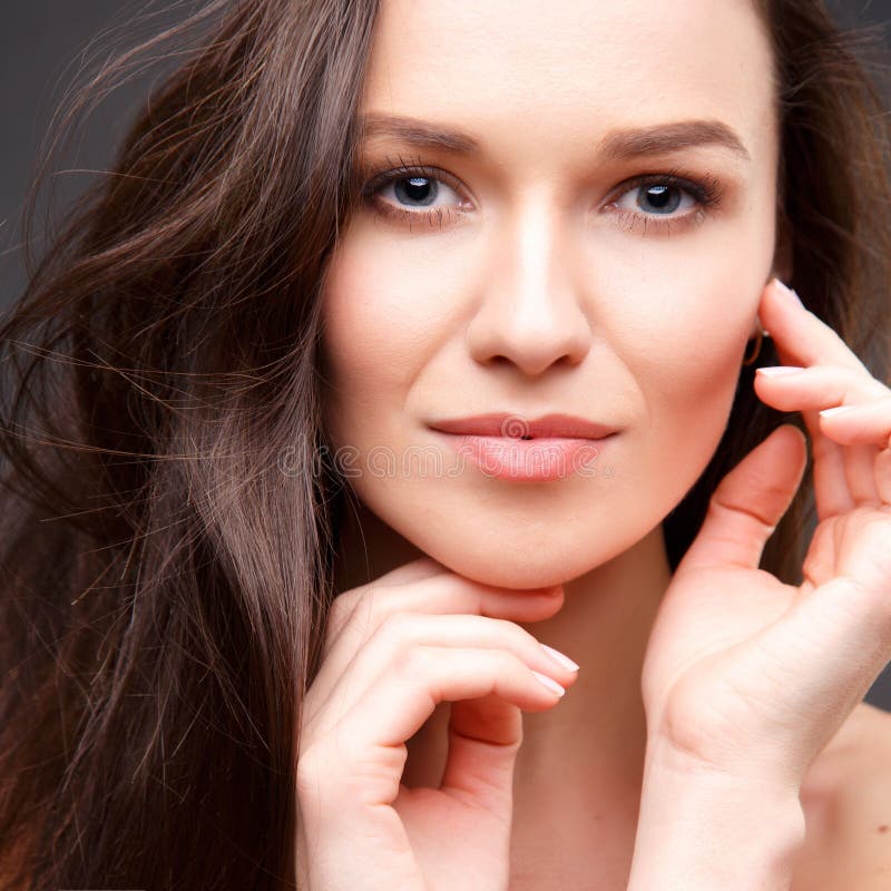 Close Up Portrait Of Elegant Brunette Woman With Nude Make Up Stock