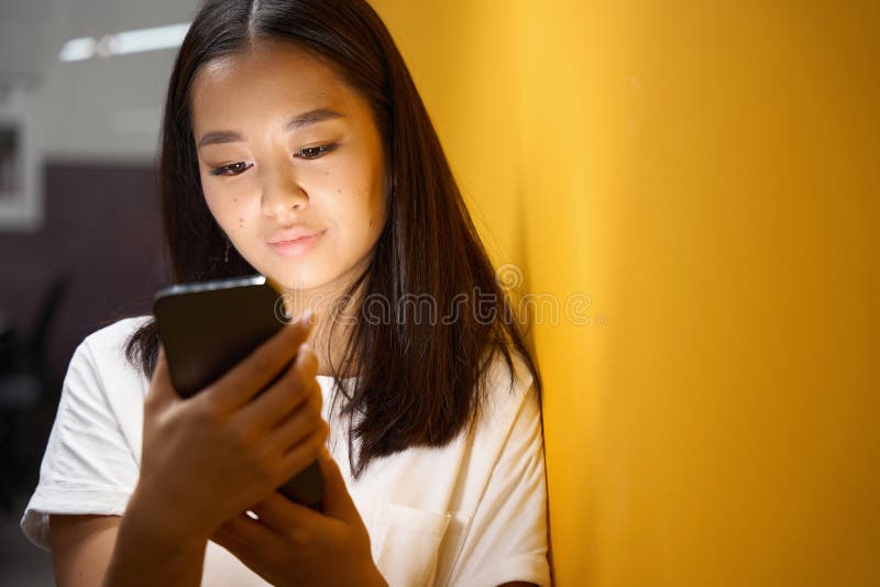 Asian Lady Holding Smartphone In The Office Stock Image Image Of Happy Holding 259970637