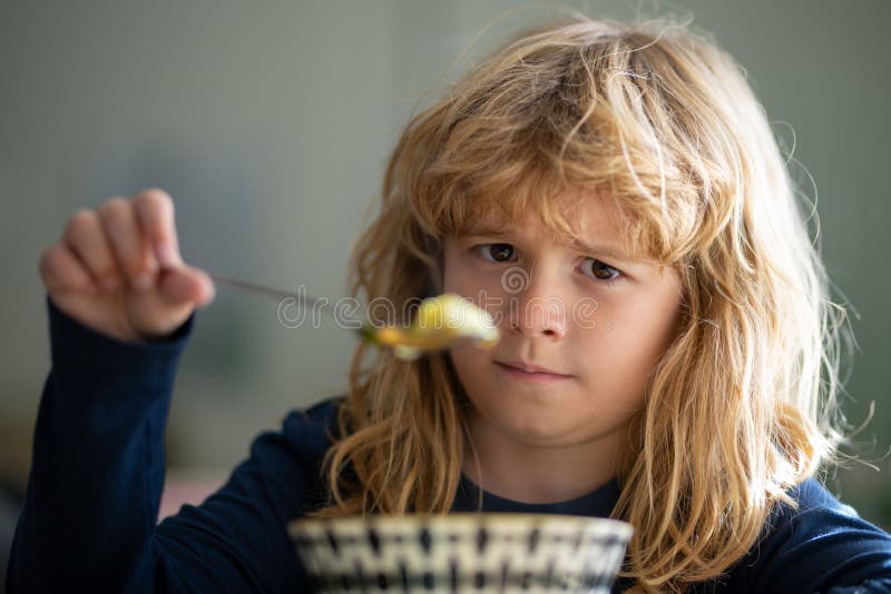 Close Up Portrait of Funny Kid Eating. Sad Boy Eating Healthy Chicken  Noodle Soup for Lunch Stock Photo - Image of bite, face: 246452460
