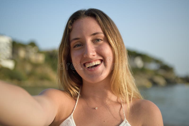 Close Up Portrait Of A Girl Laughing And Taking Selfie On The Beach Stock Image Image Of 