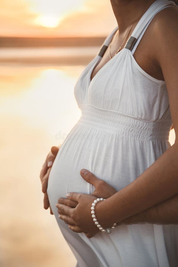 Close Up Portrait of Happy Pregnant Woman in White Dress Together with ...