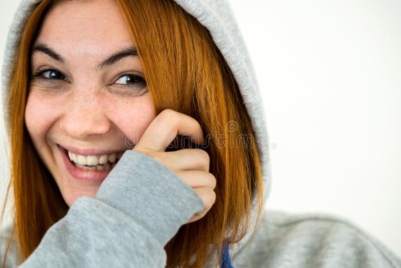 Close Up Portrait Of Happy Smiling Young Redhead Woman Wearing Warm