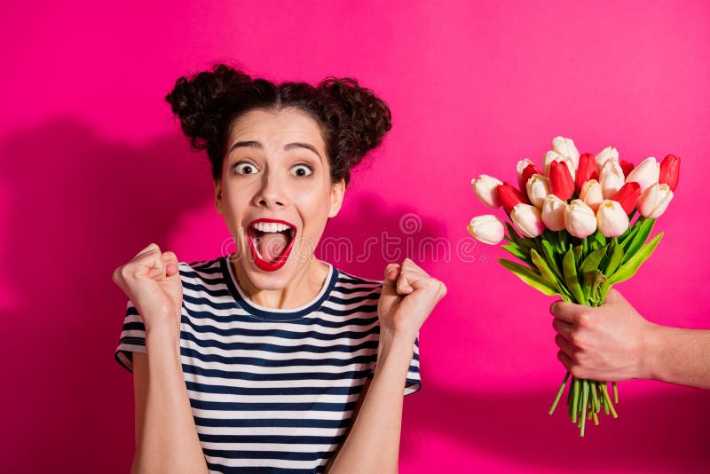 Close-up portrait of her she nice attractive glamorous overjoyed crazy cheerful cheery girl getting tulips isolated over