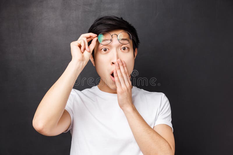 Close Up Portrait Of Impressed Astonished Asian Guy Take Off Glasses From Amazement Cover