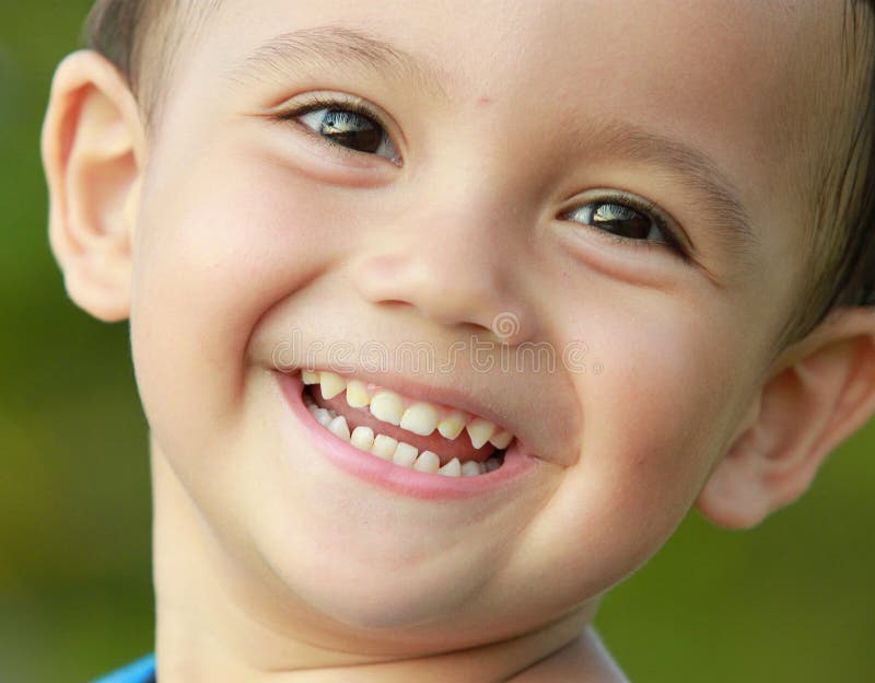 Close up portrait of mixed race kid smiling