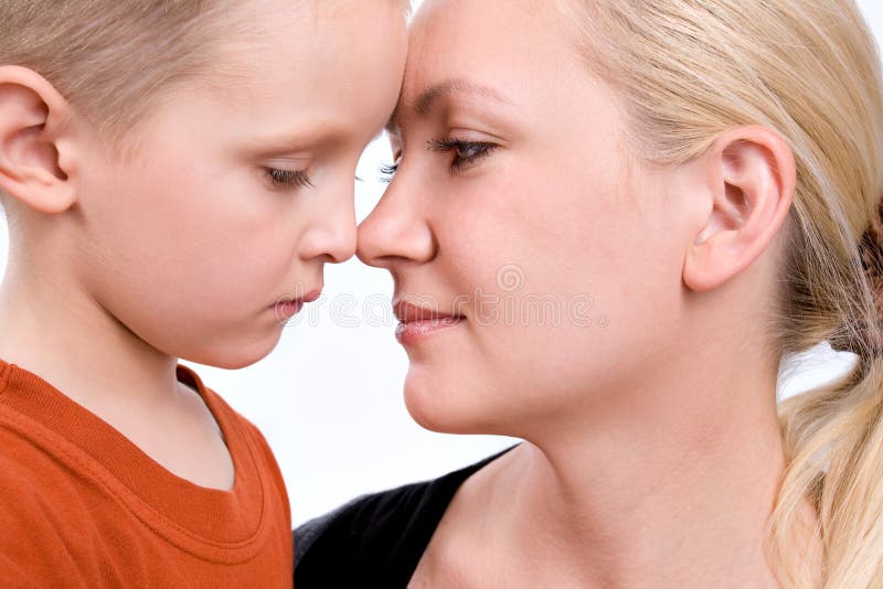 Close-up portrait of mother and son