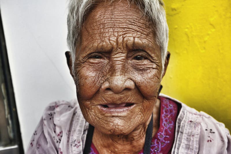 Close Up Portrait Of An Old Filipino Woman With Wrinkled Skin Editorial
