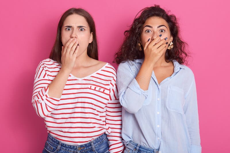 Close up portrait of pretty brunette girls, best friends or sisters, wearing casual clothing, having surprised emotions, close stock images Close up portrait of pretty brunette girls, best friends or sisters, wearing casual clothing, having surprised emotions, close stock images