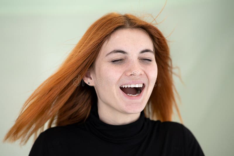 Close Up Portrait of Pretty Redhead Girl with Long Wavy Hair Blowing on ...