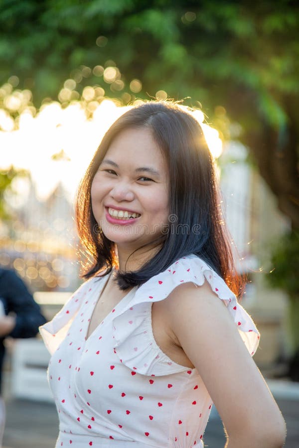 Close Up Portrait Smiling Asian Woman In A White Dress She Is Looking