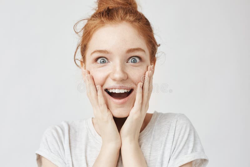 Close up portrait of surprised happy freckled redhead girl royalty free stock photography Close up portrait of surprised happy freckled redhead girl royalty free stock photography