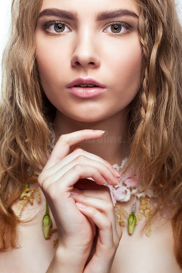 Close-up portrait of teen girl with flower necklace