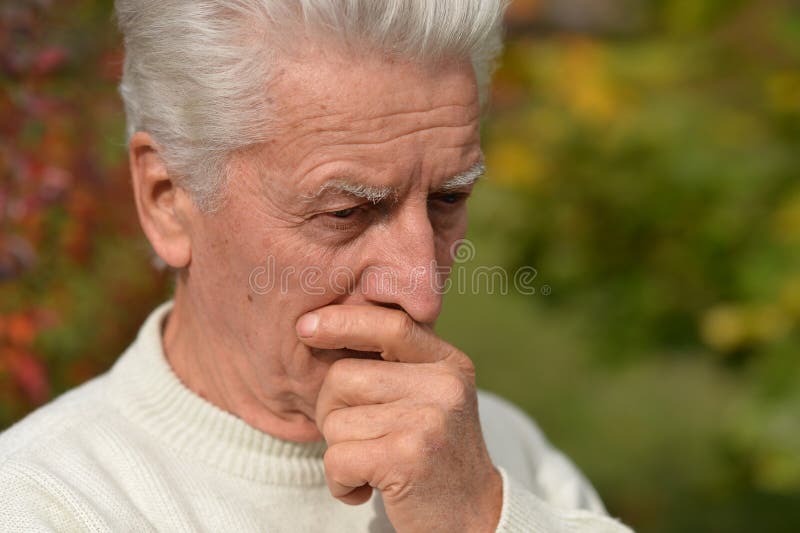 Close up portrait of thoughtful senior man outdoors royalty free stock photo Close up portrait of thoughtful senior man outdoors royalty free stock photo
