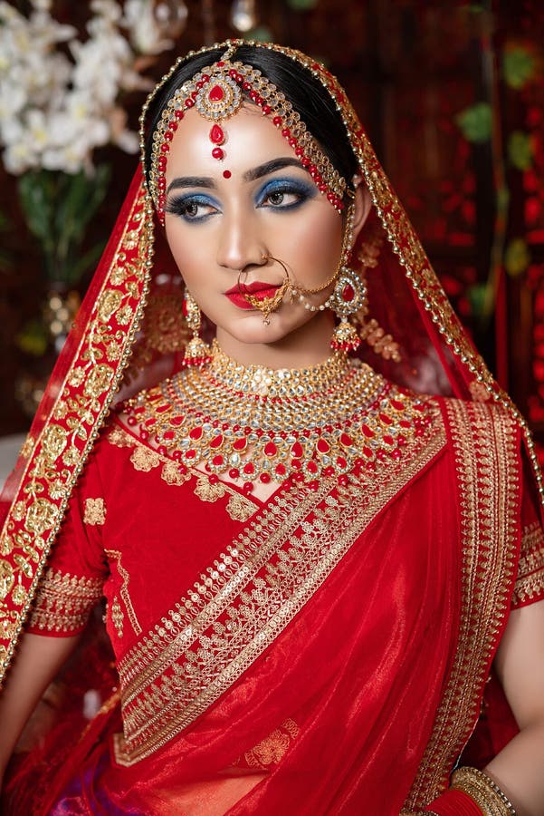 Portrait of Very Beautiful Young Indian Bride in Luxurious Bridal