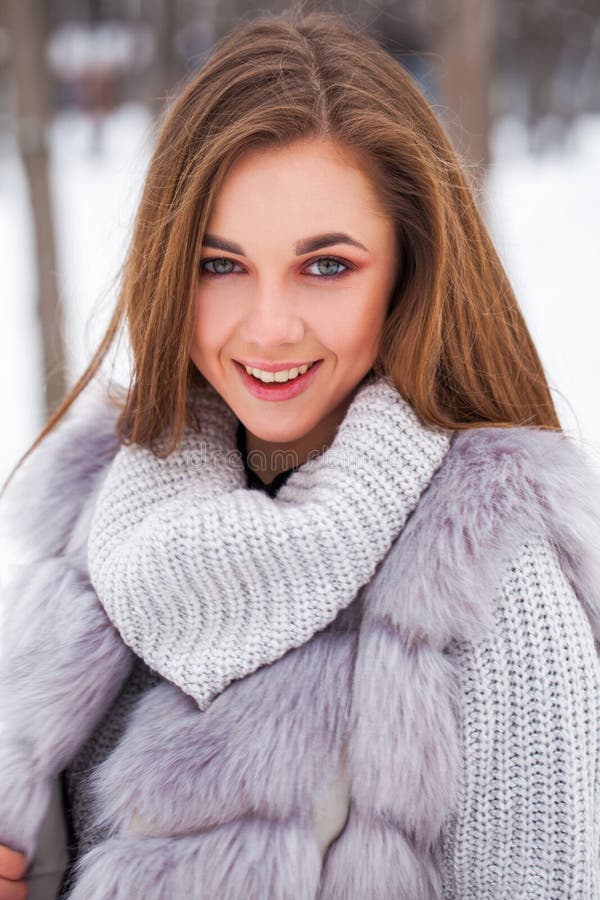 Portrait of a Young Beautiful Brunette Girl in Fur Vest Posing in ...
