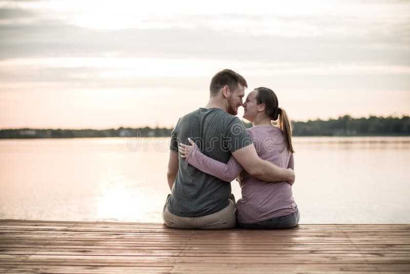 Loving couple hugging her waist close up - Stock Image - Everypixel