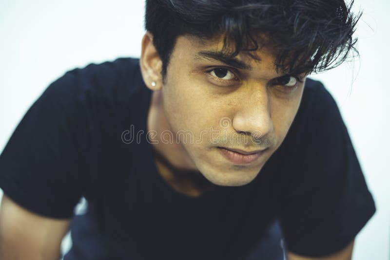 Close Up Portrait Of A Young Handsome Indian Male Clean Shaved And