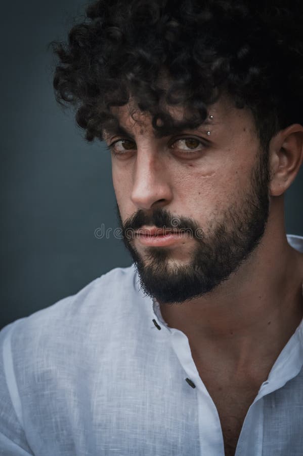 Close Up Portrait of a Young Man with a Beard and Curly Hair, Looking at  the Camera Stock Image - Image of attractive, look: 229269403