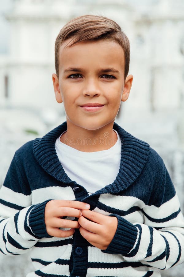 Close-up Portrait of a Young Pupil of a Schoolboy. Smiling Showing Jumper  with Stripes. Stock Image - Image of jeans, closeup: 109555077