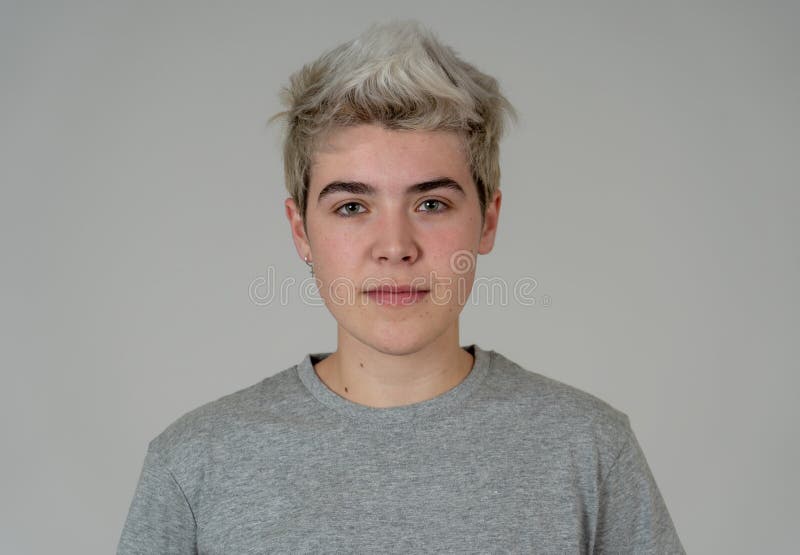 Natural portrait of young handsome transgender boy posing with neutral face expression stock photography Natural portrait of young handsome transgender boy posing with neutral face expression stock photography