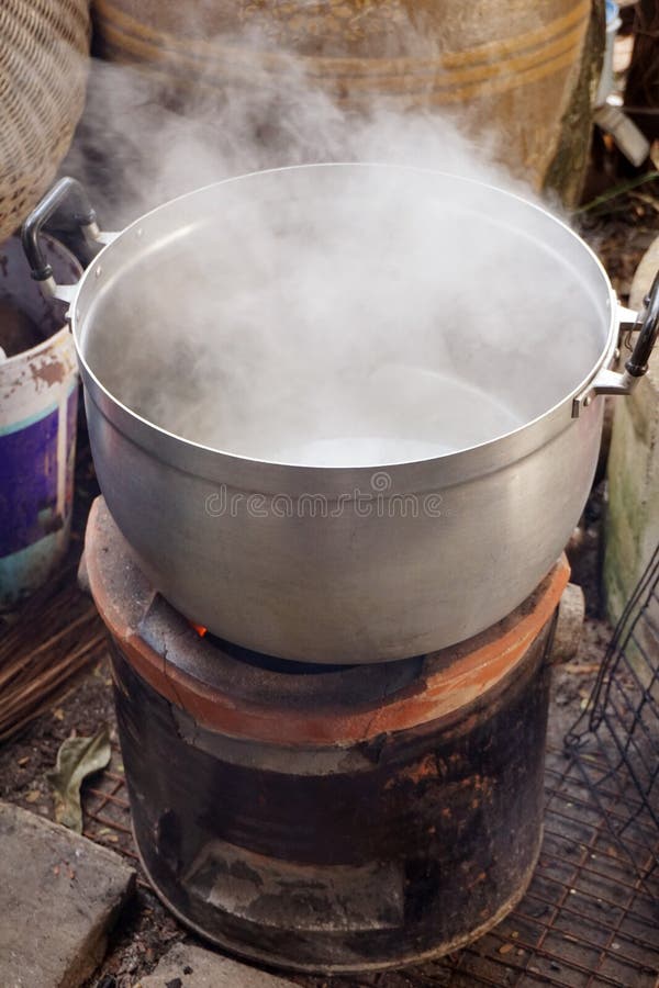 Pot boiled on fire stove stock image. Image of fire 127567253